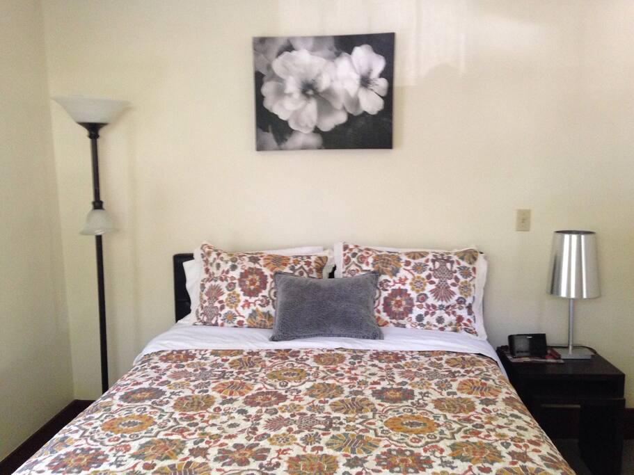 Queen bed in master bedroom.