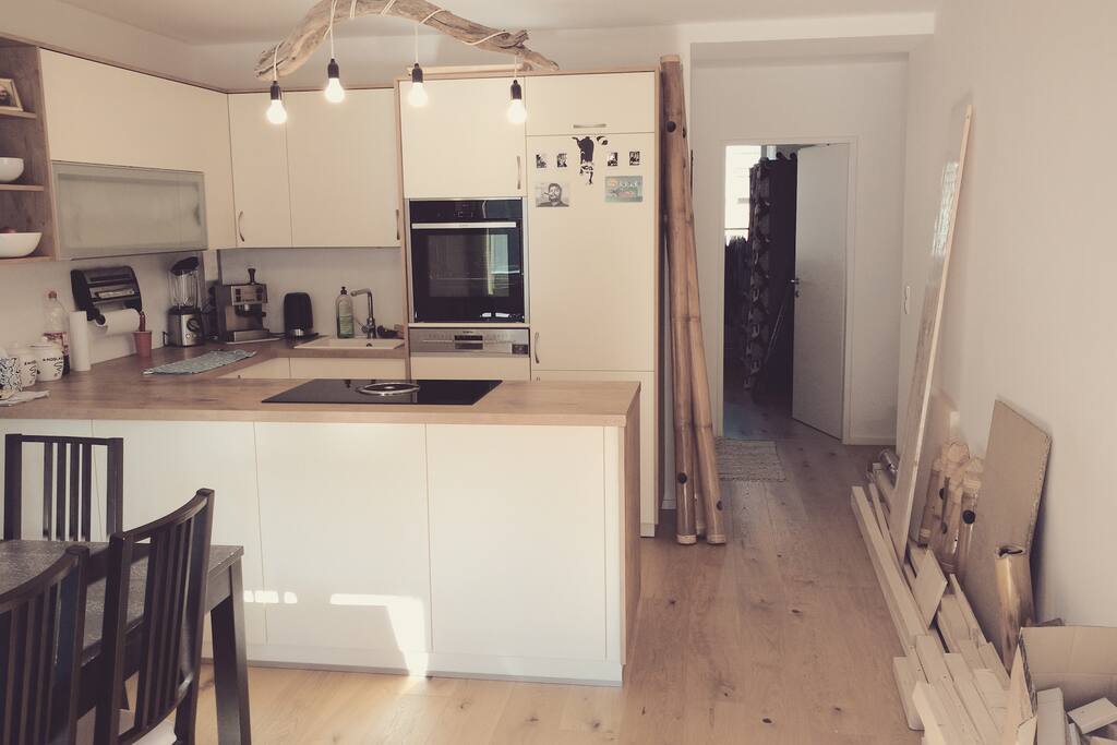 In this picture you can see that there is still a bit of wood stored in the flat, which will be gone before your arrival. The hallway behind it leads to the three bedrooms and the bathroom.