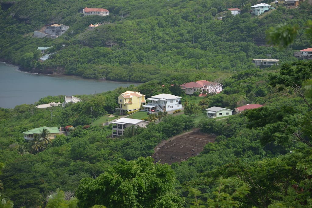 See the extensive farming a stones throw away surrounded by lush vegetation and villages