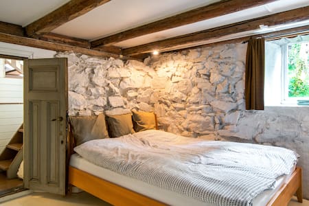 Charming old wooden house with a garden, central.