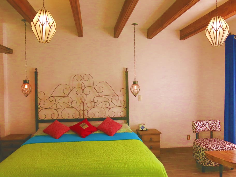 Spacious room with wooden beams on the ceiling.