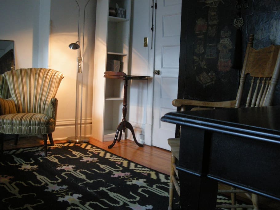The Bedroom's sitting area along with a large desk.