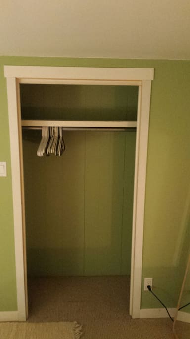 Emptied closet with hangers.