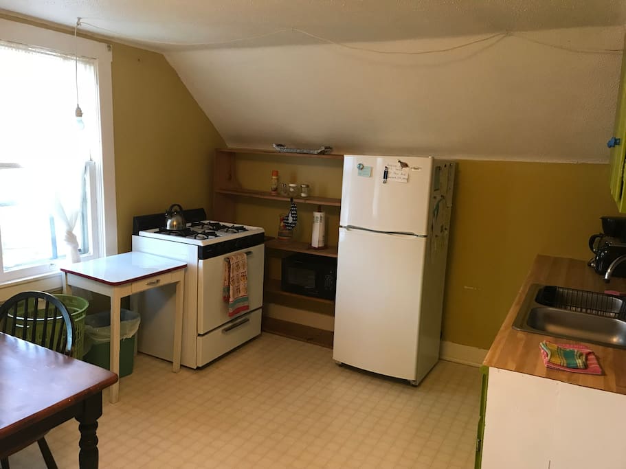 The cozy kitchen gets lovely south-facing light.