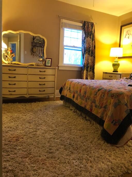 The master bedroom is on the second floor and has a queen sized bed.