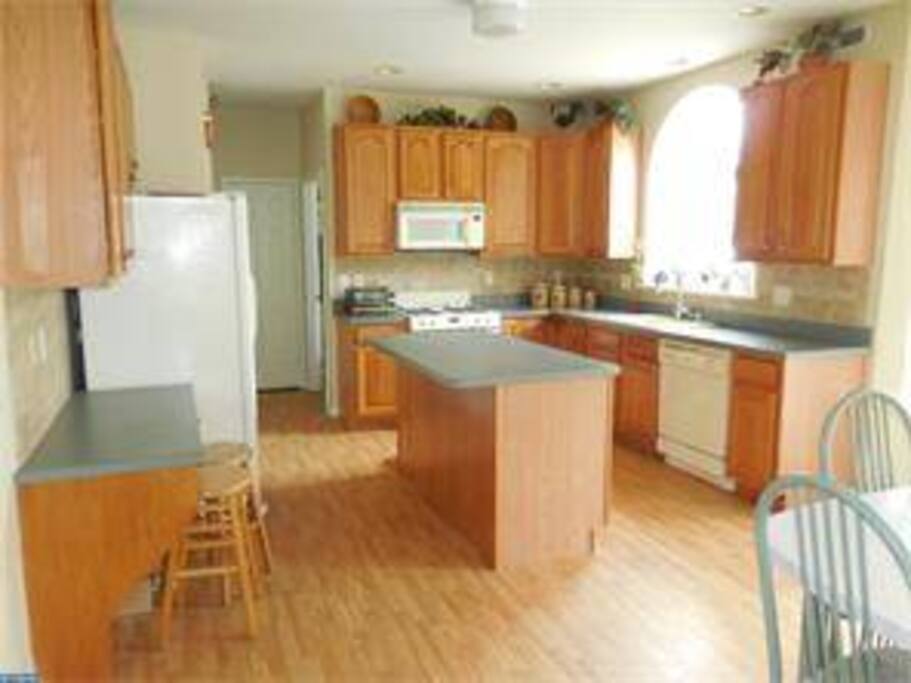 Kitchen has available to you pots, pans, plates, silverware, glasses, pantry to store canned and dry foods, and fridge/freeze. Straight back behind where the microwave is, is where the laundry room is located.