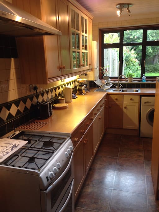 Fully equipped Kitchen. Gas oven. Washing machine with fast wash cycle. Adjacent to Breakfast room and door to patio.