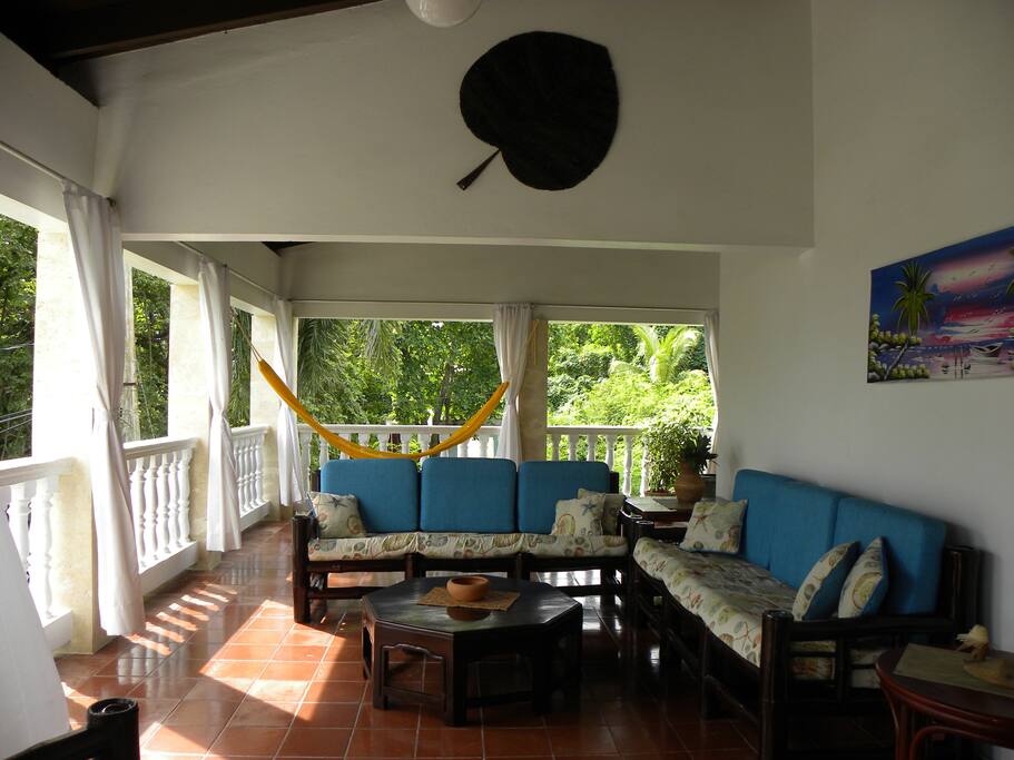 BALCONY SEATING AND YELLOW HAMMOCK