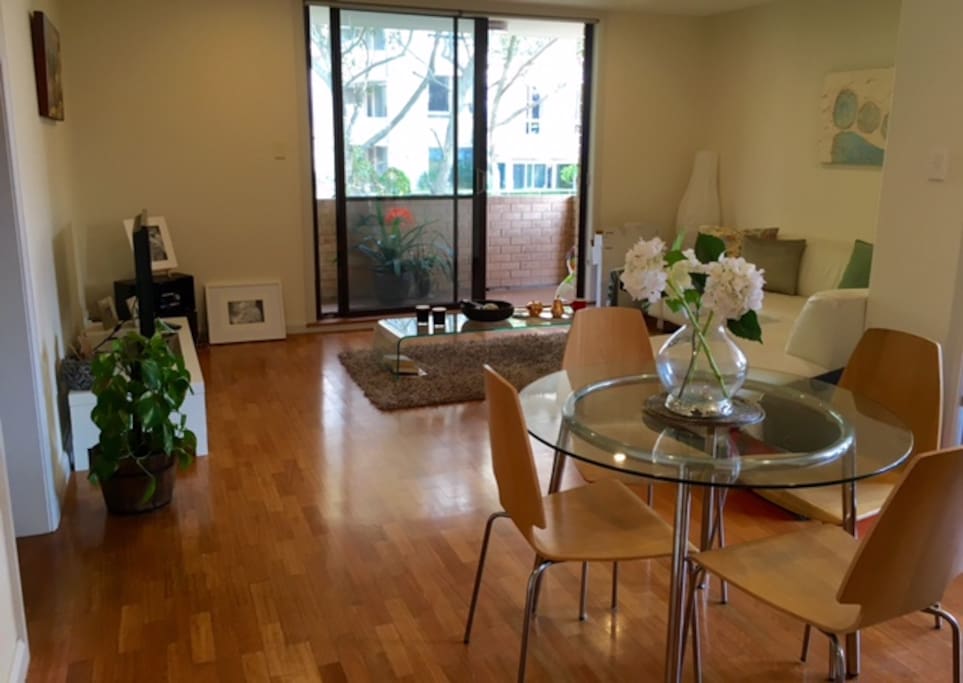 Spacious open plan living with dining, lounge area leading onto 2 balconies.