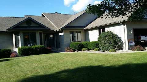 Ranch house with beautiful deck and patio.