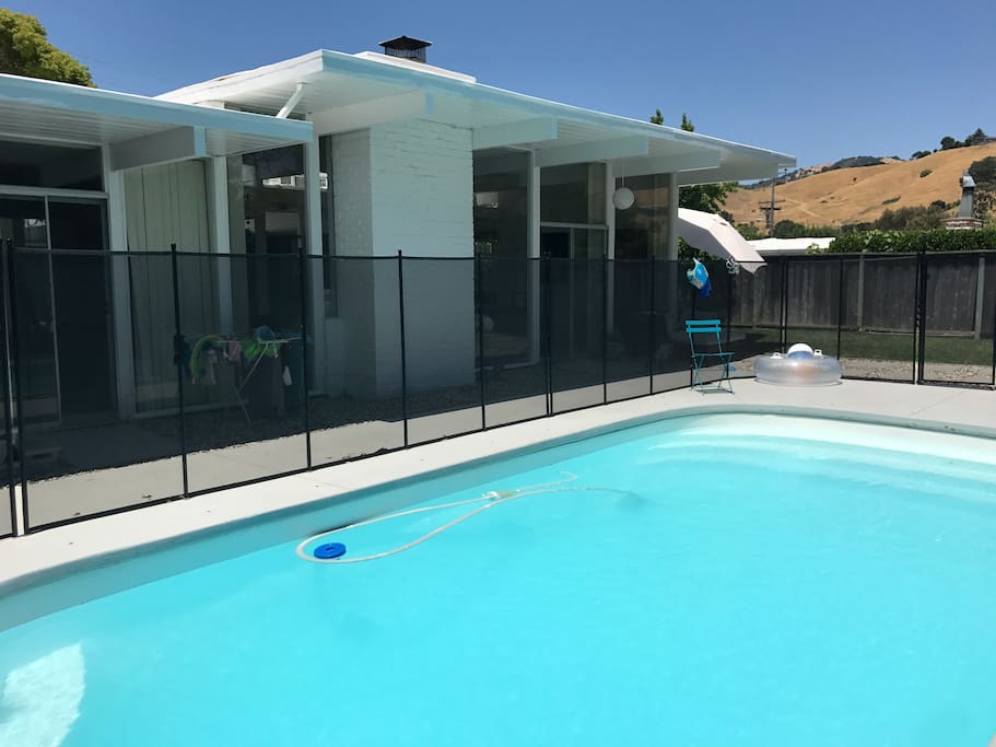 Pool is protected with a 5 foot self-closing fence