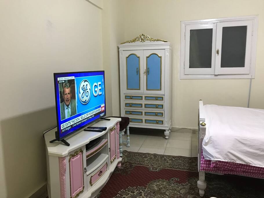 tv, cupboard, window, chair, tv table