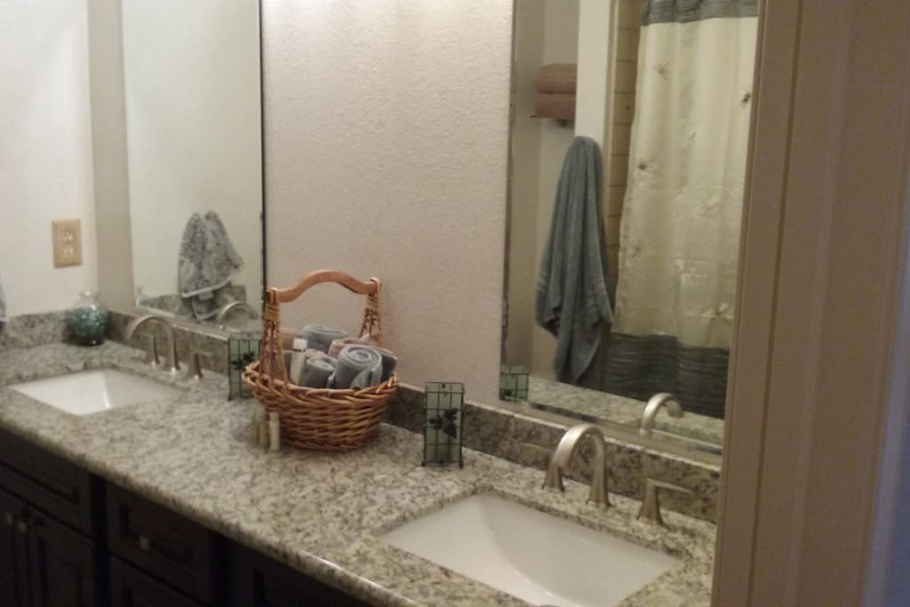 Full bath with double sinks.