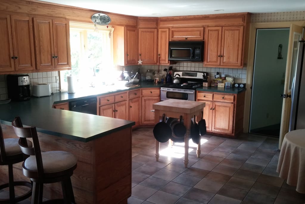 The large kitchen creates a group experience with lots of counter space and bar stools
