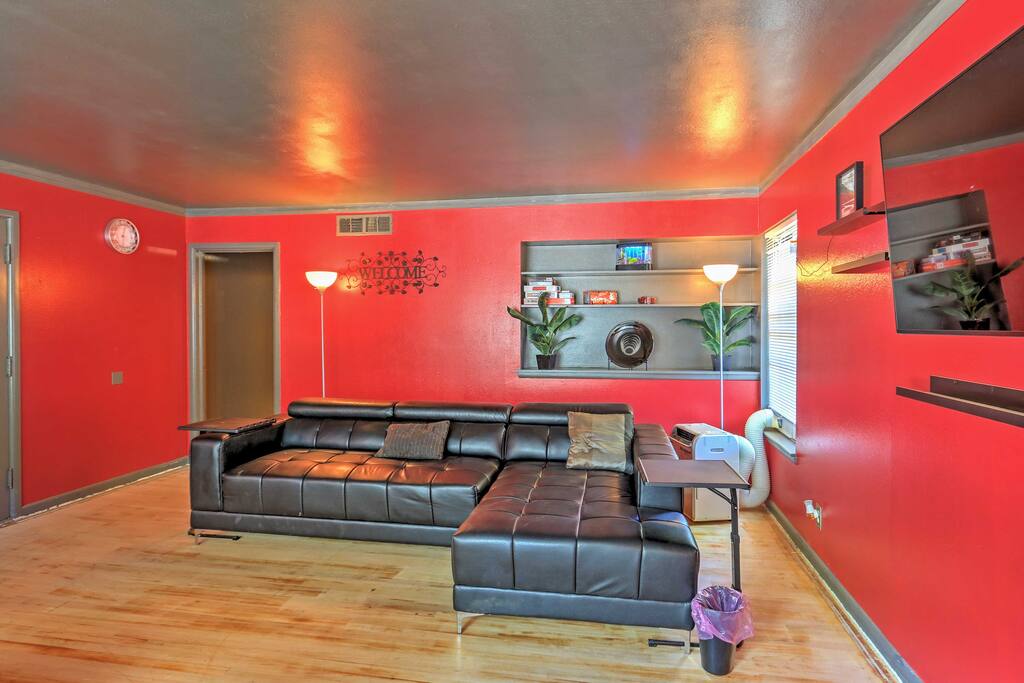 A spacious living room with a large sectional sofa offers plenty of room for your guests to mingle.
