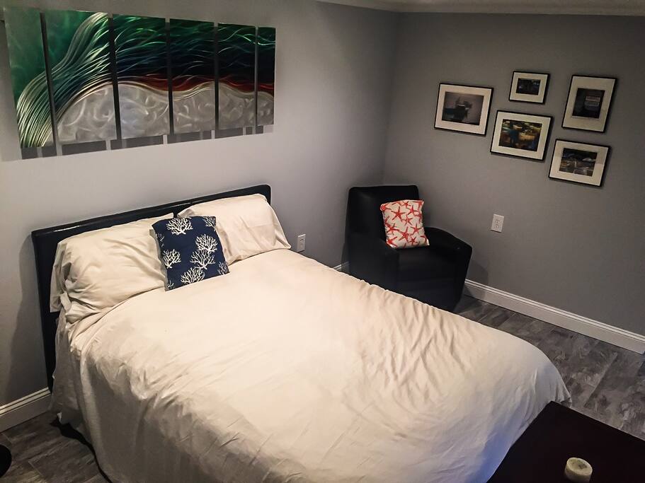 Nautical-themed room with art and photography from local artists