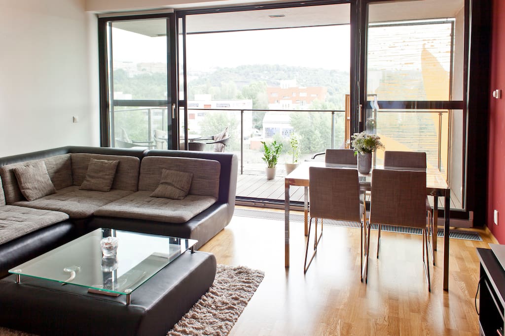 Spacious living room with terrace and river views