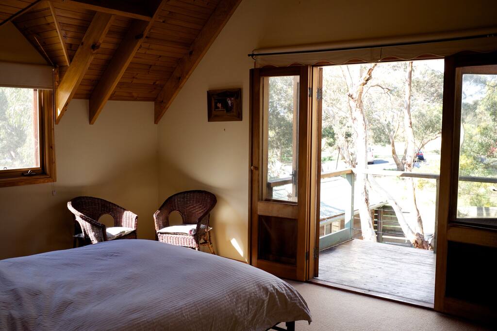 Master bedroom- queen bed with balcony.