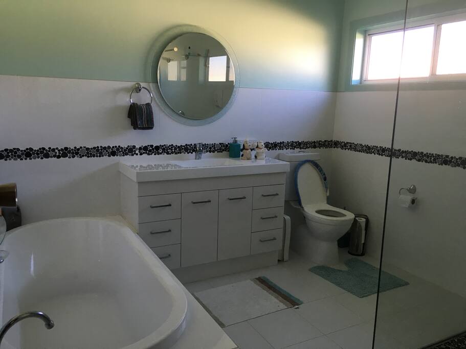Spacious bathroom including a bath tub
