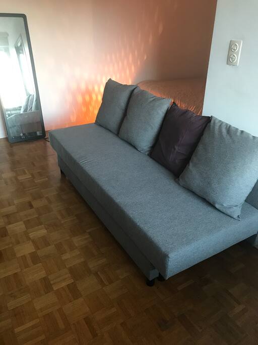 Comfortable couch towards the Tv