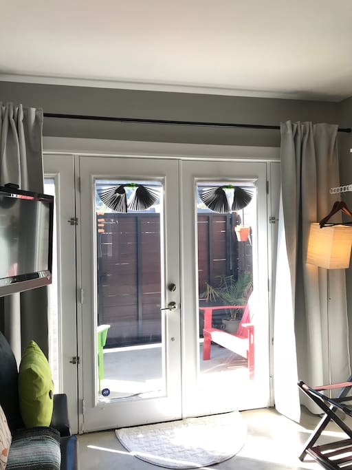 Double-paned French doors let in lots of light, but reduce noise and heat, and open to your private patio.