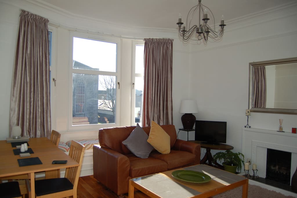Dining table accommodates 6 people comfortably. The bay window is large overlooking the Parish Church with a comfortable window seat.