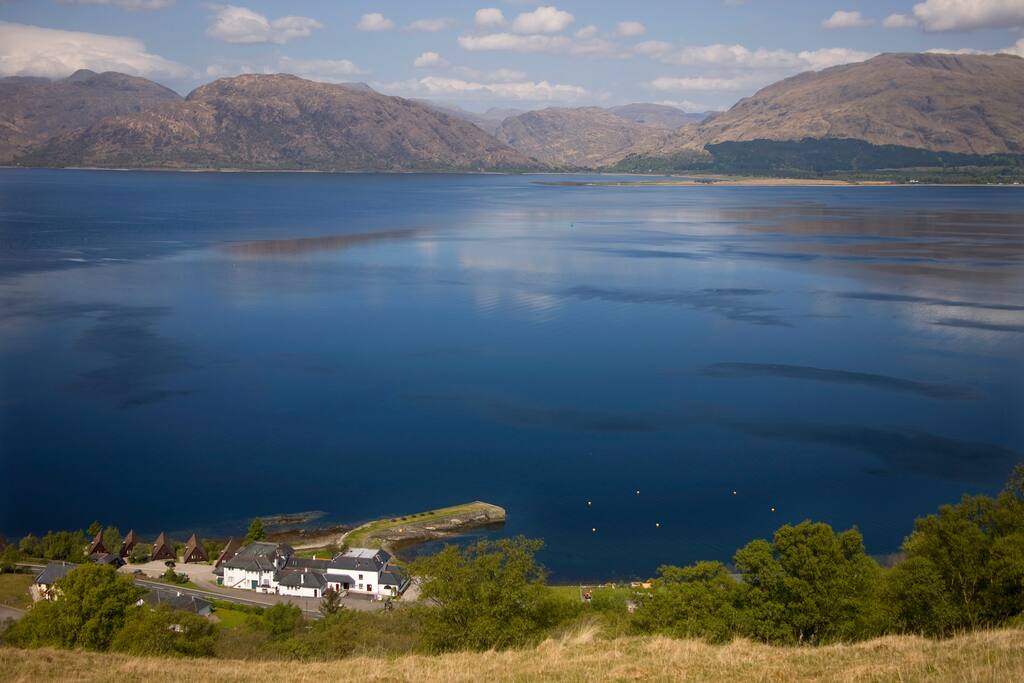 View from hill above lodges to lodges and pier.