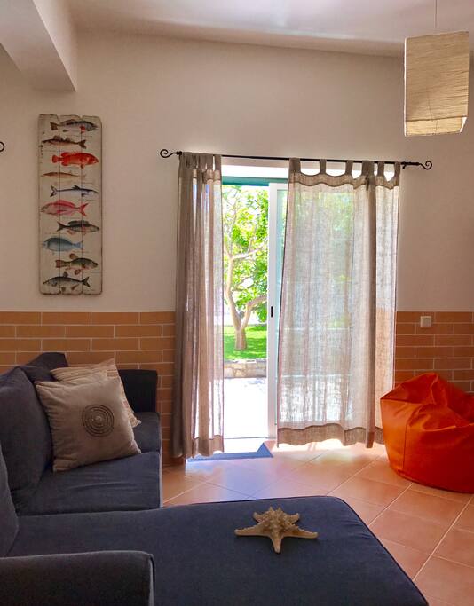 Large living area open to a beautiful sunny patio