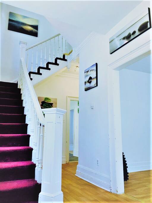 Foyer/main entrance staircase leading to second floor.