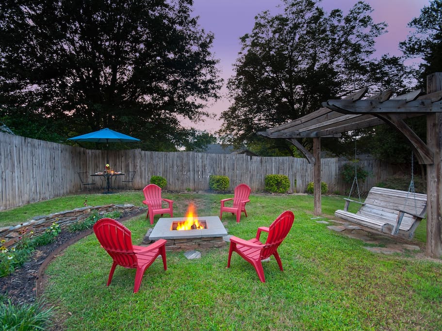 After a long day, relax around the fire pit or swing away your stress in our backyard paradise.