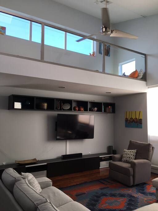 View from behind the couch showing the catwalk and fan
