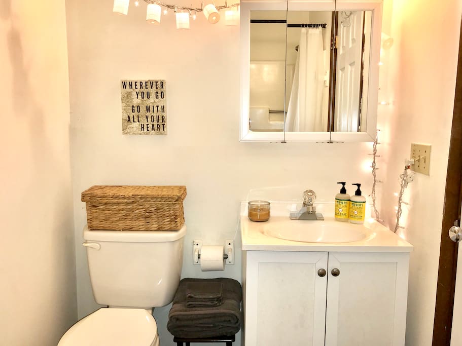 Bathroom with full shower, and basic toiletries provided.