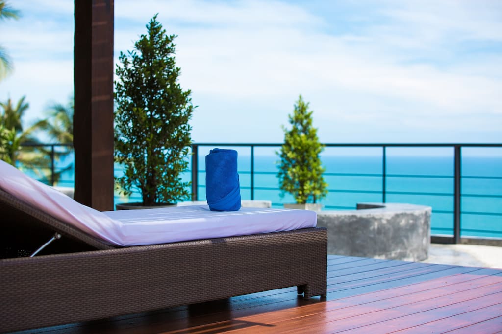 roof top terrace with sunbeds with stunning sea view and mountain view