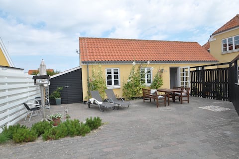 Successful Airbnb property: Charming holiday apartment with sunny patio in Hjørring