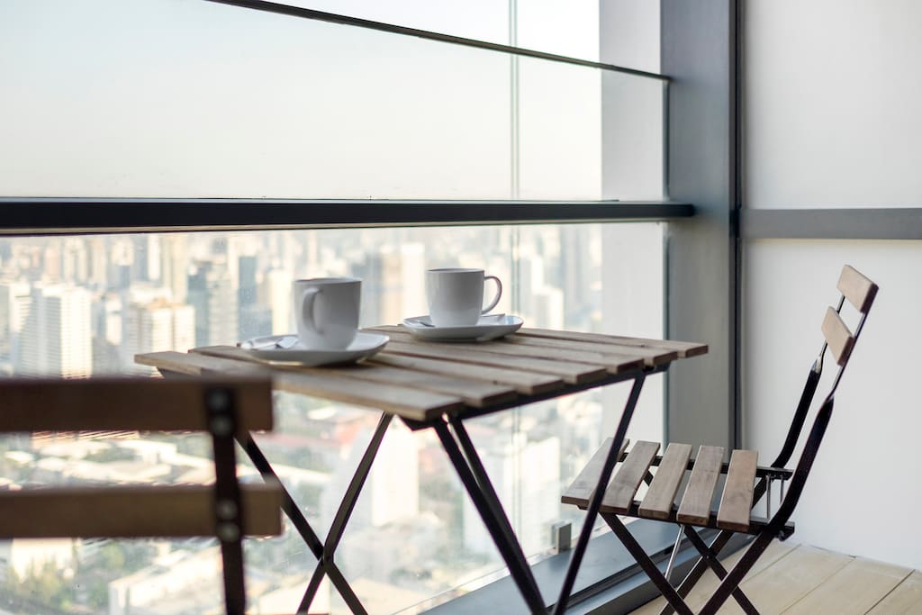 Having breakfast on the balcony watching the sunrise