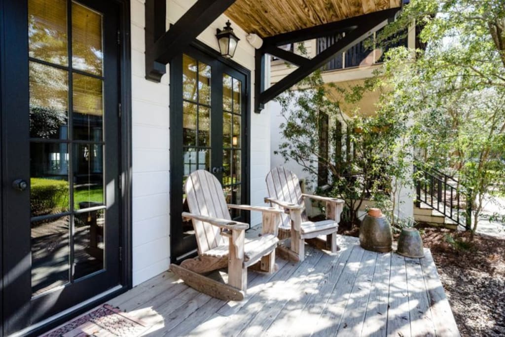 Wooden back deck, shaded by oak trees