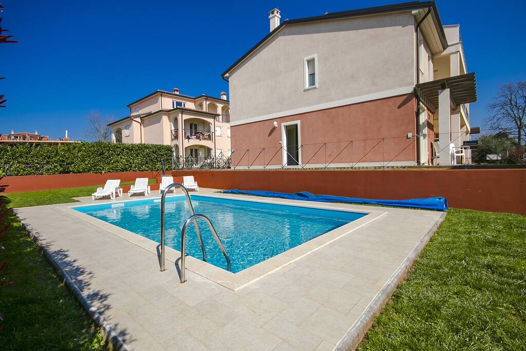 Swimming pool and ap.building