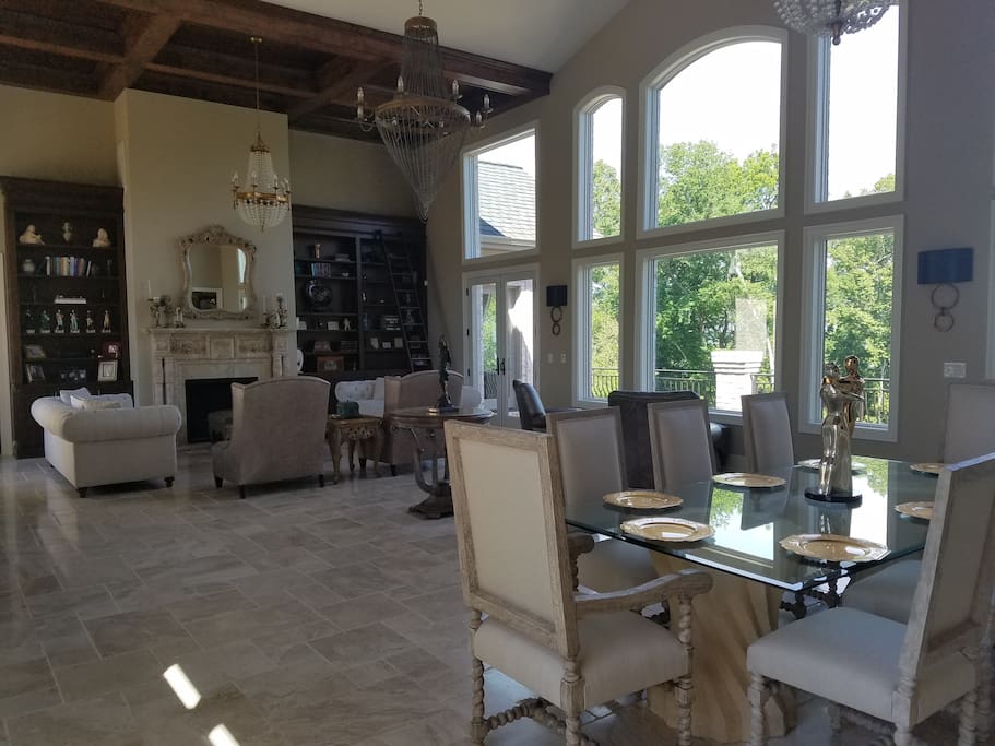 Entertainment area with wetbar and outdoor balcony with sound system in main indoor and outdoor patio areas.
