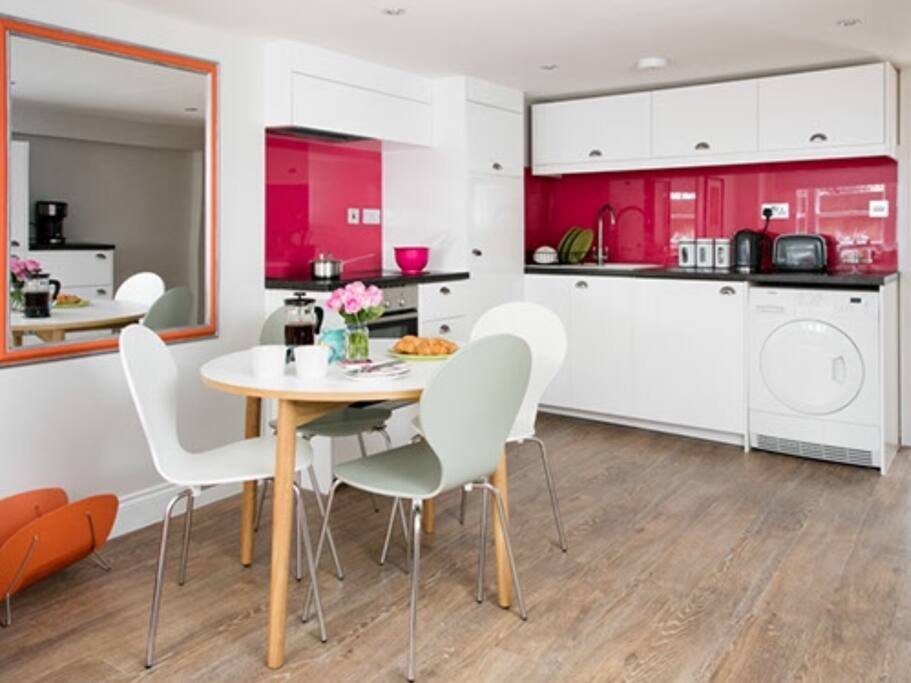 dining table and fully equipped kitchen