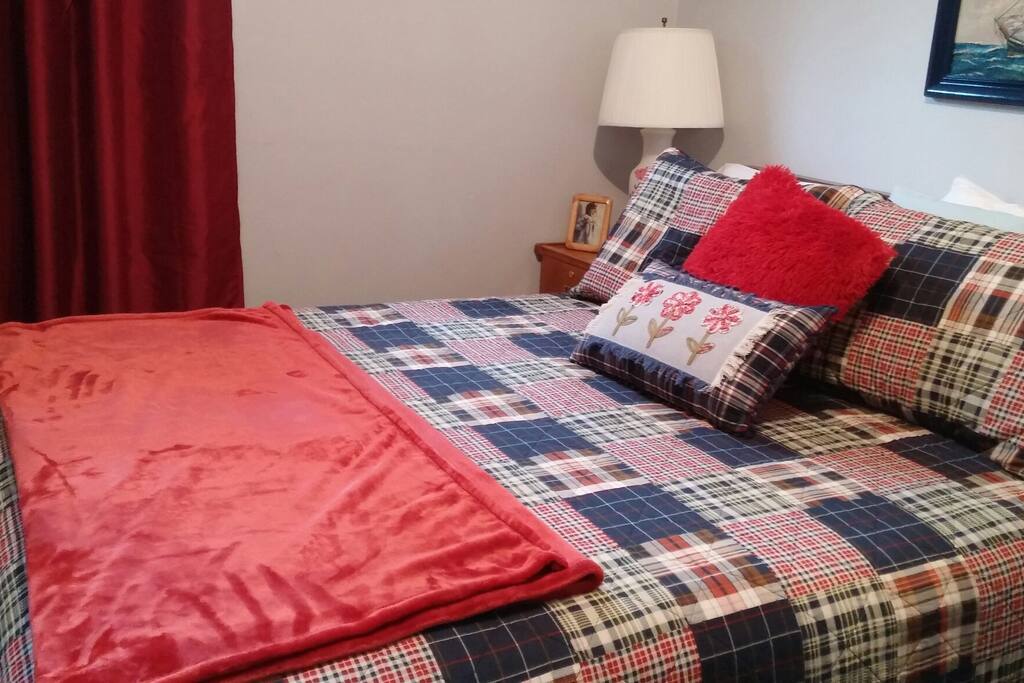 The new bed and quilt set. Two windows allow lots of light into the room