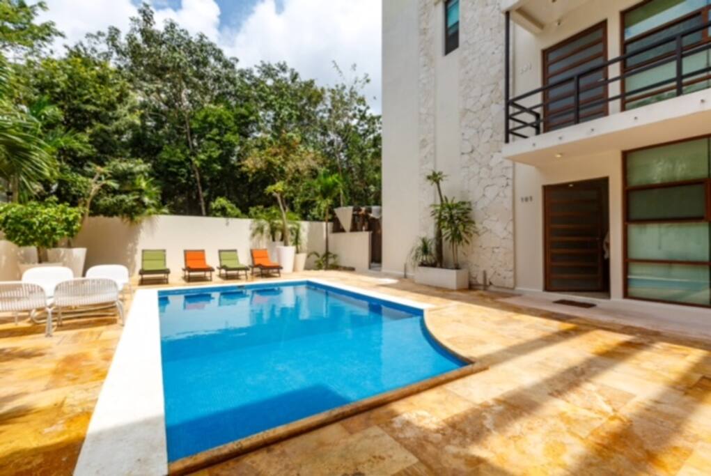 Cool off in the sparkling water of your pool after a day at the beach