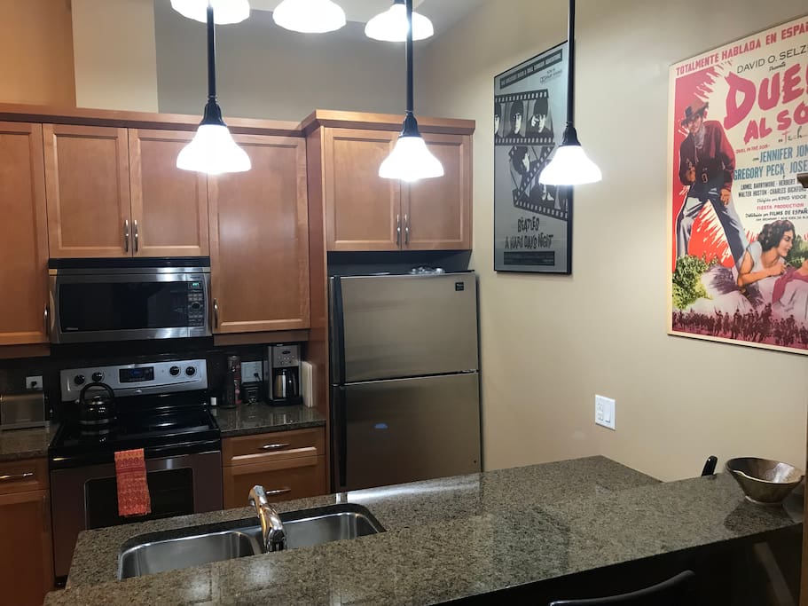 Fully stocked kitchen with eating bar