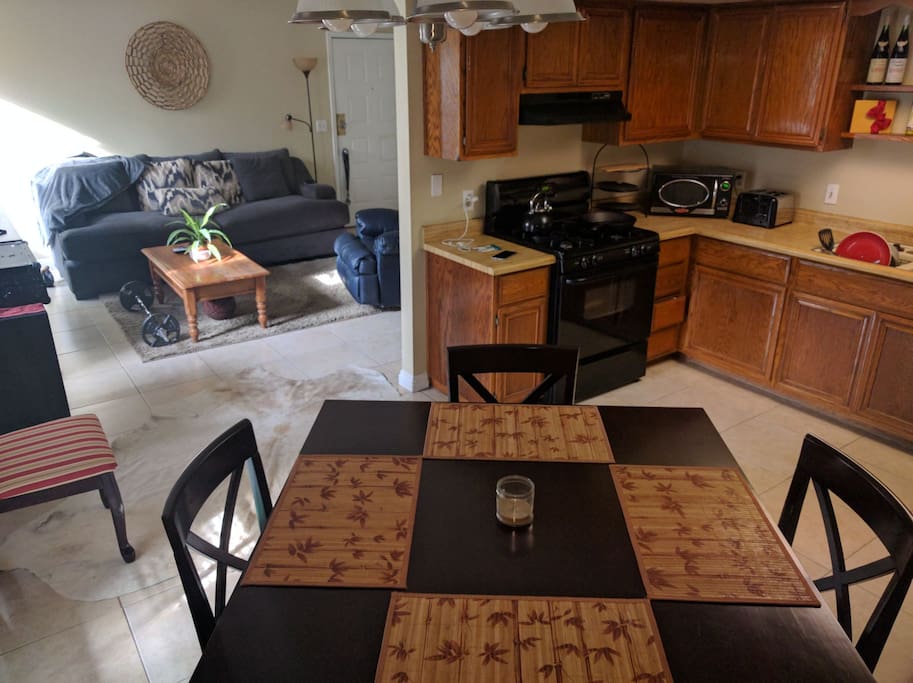 Open and spacious full kitchen and dining area with conventional and microwave ovens.