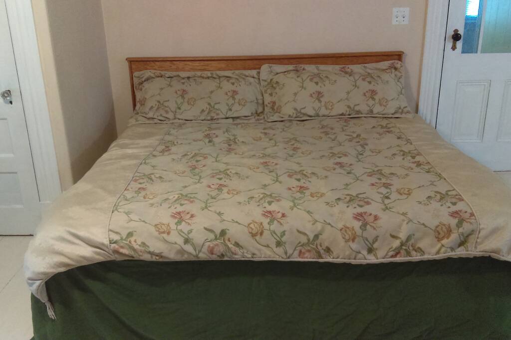 Front of bed, nice comforter or use sheets if you prefer