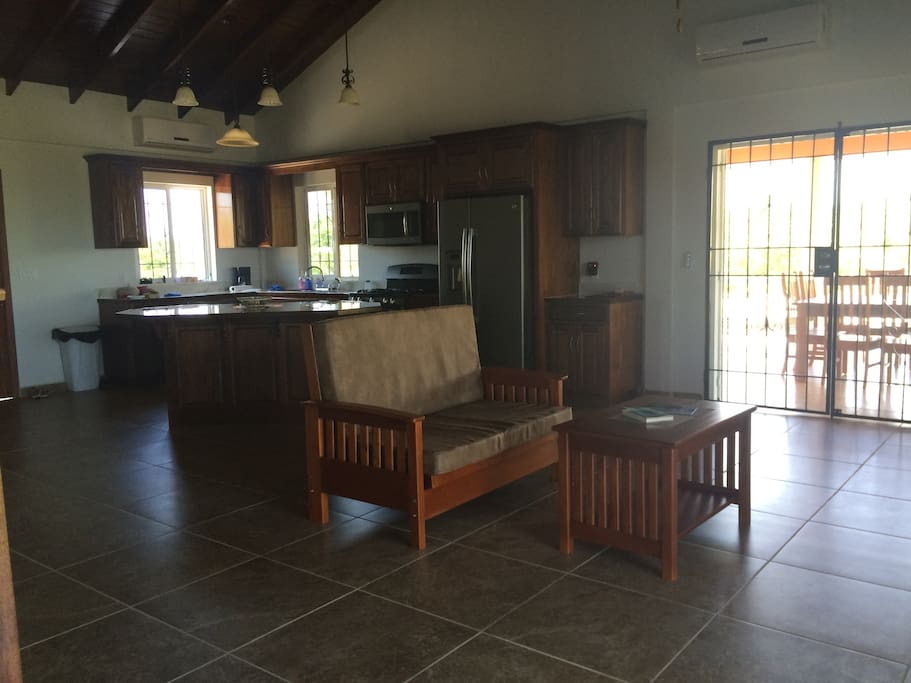 Livingroom, kitchen, doors go onto large deck