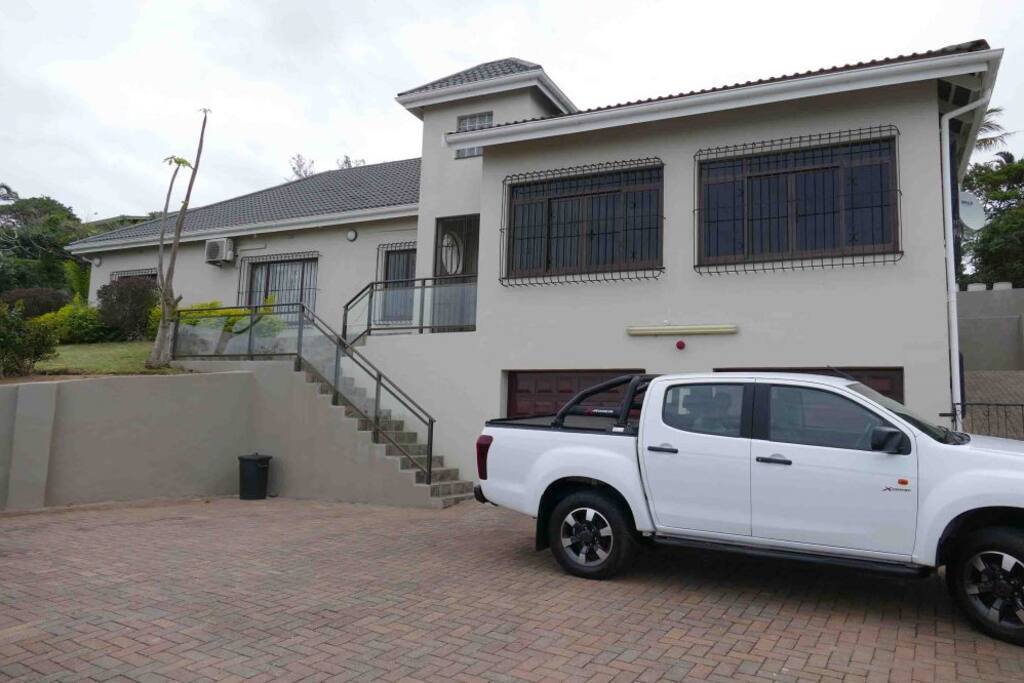 Driveway and Front View Of House