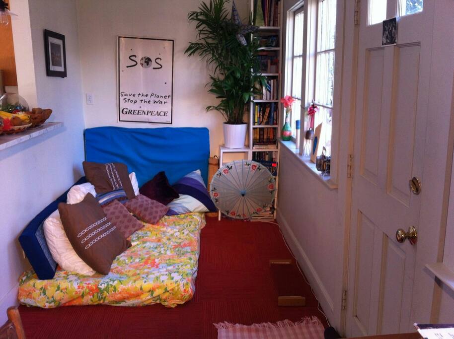 Sunroom with extra bed.