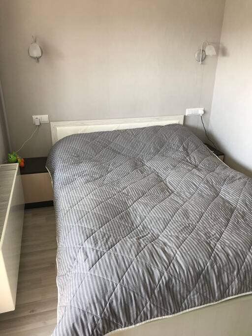A bed for two. Separate blankets.