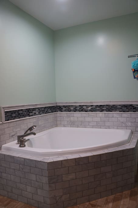 Master Bath (large corner tub with a separate shower).