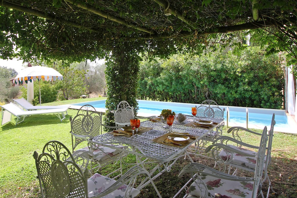 Dining table outside and pool